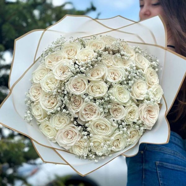 An enchanting bouquet of 36 roses accompanied by delicate gypsophila, also known as 'baby's breath'.