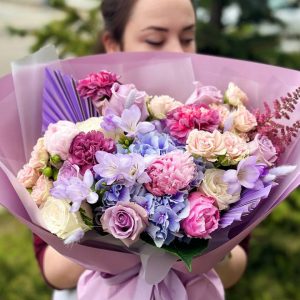 Exquisite floral arrangement: hydrangeas, freesia, roses, spray roses, astilbe, dianthus, lagurus, peony, dried flowers.