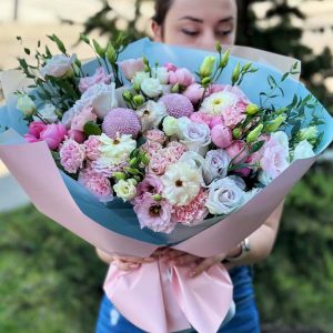 "Golden Opera" bouquet with eustoma, dahlias, Butterfly ranunculus, roses, spray roses, eucalyptus, chrysanthemums, and dianthus.