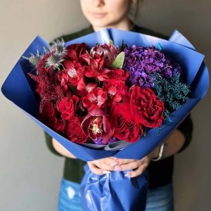 The "Eternal Elegance Orchid Bouquet" showcases a mesmerizing blend of hydrangeas, orchids, spray roses, and other exquisite blooms.