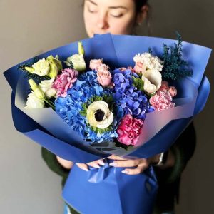 "Ethereal Blossom Dream" bouquet showcases hydrangeas, lisianthus, dianthus, astilbe, spray roses, and anemones in a captivating blend of diverse botanicals.