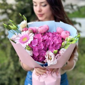 A close-up view of the Pink Serenity Harmony bouquet, showcasing its exquisite Silva Pink hydrangeas, vibrant gerbera daisies, and graceful lisianthus.