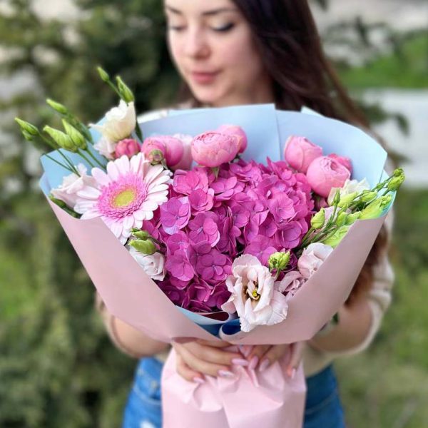 A close-up view of the Pink Serenity Harmony bouquet, showcasing its exquisite Silva Pink hydrangeas, vibrant gerbera daisies, and graceful lisianthus.