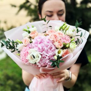 Bouquet featuring 'Touching Floral Moment' with hydrangeas, anemones, spray roses, lisianthus, eucalyptus, and dianthus.