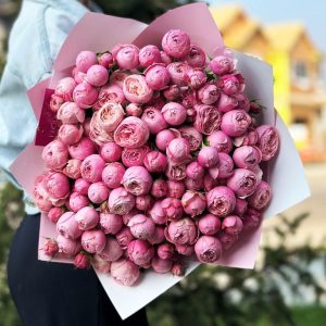 Bouquet featuring 'Pink Radiance' with delicate pink blooms and lush greenery.