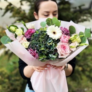 Summer Serenity' featuring a harmonious blend of hydrangeas, roses, dianthus, spray roses, lisianthus, and eucalyptus—a sensory experience of summer's beauty.