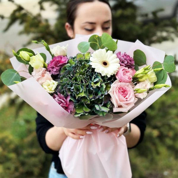 Summer Serenity' featuring a harmonious blend of hydrangeas, roses, dianthus, spray roses, lisianthus, and eucalyptus—a sensory experience of summer's beauty.