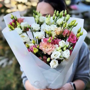 The "Mono Eustoma Elegance" features exquisite eustoma blooms, embodying grace and elegance in a monochromatic bouquet.