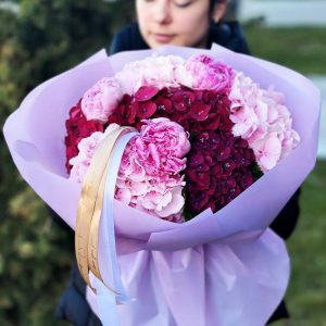 A close-up view of the "Peony and Hydrangea Elegance" bouquet, showcasing the delicate peonies and lush hydrangea blooms in an elegant and serene floral composition.