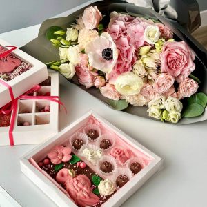 Image of the "Enchanted Garden Tapestry" bouquet featuring hydrangeas, serruria, anemones, spray roses, dianthus, ranunculus, lisianthus, and eucalyptus, a botanical masterpiece that celebrates life's magical moments.