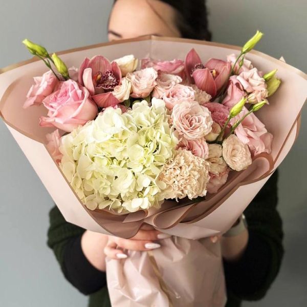 Exquisite Bloom: A vibrant bouquet with hydrangeas, roses, spray roses, dianthus, orchids, and lisianthus, creating a harmonious symphony of colors and textures.