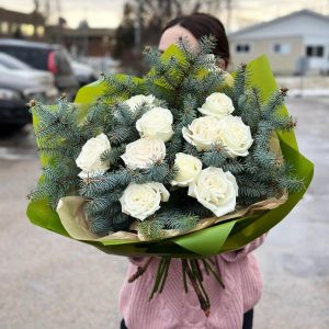 Luxury and Scent Bouquet: roses and pine branch, creating a festive mood and aromatic atmosphere.