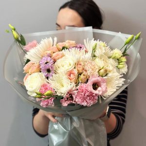 Radiant Blossoms: A captivating bouquet featuring roses, chrysanthemums, lisianthus, dianthus, and spray roses, creating a harmonious blend of colors and textures.