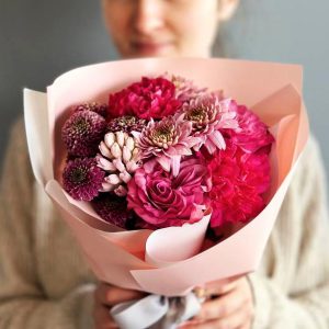 Spring Symphony: A harmonious arrangement showcasing roses, hyacinth, chrysanthemums, and dianthus, creating a captivating symphony of colors and scents.