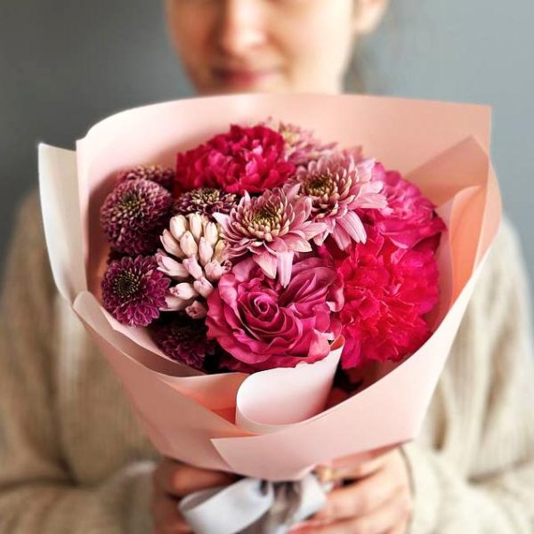 Spring Symphony: A harmonious arrangement showcasing roses, hyacinth, chrysanthemums, and dianthus, creating a captivating symphony of colors and scents.