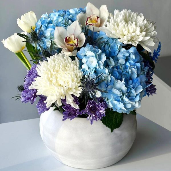 Eternal Harmony: A stunning vase arrangement showcasing hydrangea, chrysanthemums, tulips, orchids, eryngium, and solidago, creating a perfect balance of beauty and diversity.