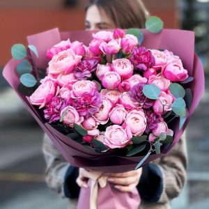 Sophisticated Charm Bouquet: An enchanting arrangement showcasing the delicate allure of spray roses, the romantic charm of dianthus, and the refreshing aroma of eucalyptus.