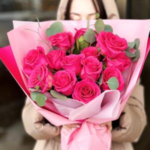 Eucalyptus Embrace Bouquet: A captivating arrangement featuring roses and eucalyptus, creating a harmonious blend of colors and fragrances, ideal for special occasions or adding charm to your space.