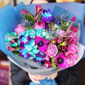 Whimsical Garden Delight Bouquet featuring hydrangeas, anemones, alstroemeria, spray roses, eryngium, dendrobium orchids, and dried flowers