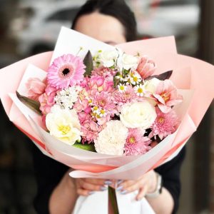 Spring Blooms Medley Bouquet showcasing hydrangeas, tulips, gerberas, coronations, daisies, and roses for a vibrant and cheerful display.