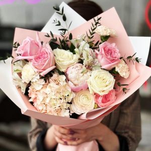 Enchanting Garden Medley Bouquet showcasing hydrangeas, peonies, ranunculuses, carnations, alstroemerias, roses, and eucalyptus for a lush and captivating display.