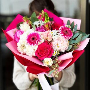 Spring Blossom Extravaganza Bouquet showcasing hydrangeas, roses, gerberas, tulips, alliums, peonies, eucalyptus, ornithogalums, and daisies for a lavish and enchanting display.