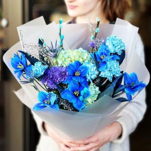 Spring Meadow Harmony Bouquet showcasing hydrangeas, tulips, dianthuses, eryngiums, chrysanthemums, and willow catkins for a whimsical and harmonious display.