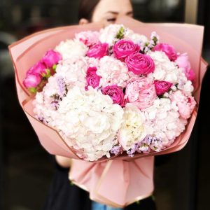 Summer Bliss Bouquet showcasing hydrangeas, peonies, spray roses, and statice for a vibrant and refreshing display.