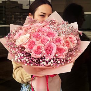 Romantic Rose Delight Bouquet showcasing luxurious roses, delicate gypsophila, and regal coronas for a captivating and romantic display.