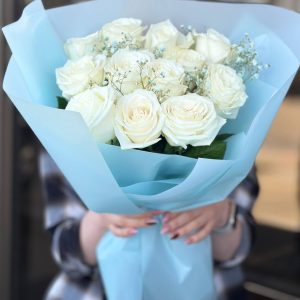 An array of vibrant flowers arranged in a beautiful bouquet, featuring roses, daisies, and tulips in a variety of colors, perfect for gifting or adding a touch of elegance to any space.