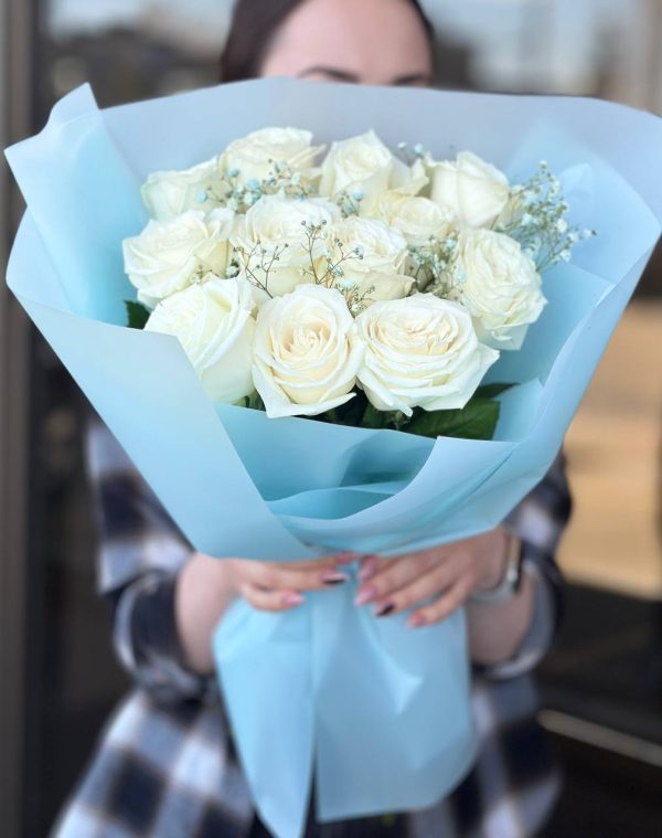 An array of vibrant flowers arranged in a beautiful bouquet, featuring roses, daisies, and tulips in a variety of colors, perfect for gifting or adding a touch of elegance to any space.