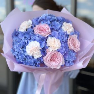 "Colorful bouquet of assorted flowers including roses, lilies, and daisies arranged in a glass vase, perfect for gifting or decoration.
