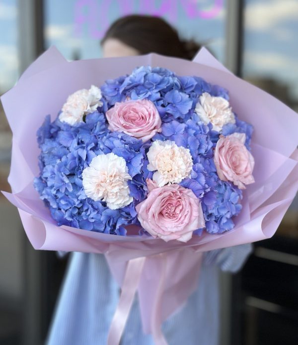 "Colorful bouquet of assorted flowers including roses, lilies, and daisies arranged in a glass vase, perfect for gifting or decoration.