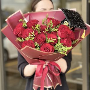 A cheerful Happy Graduate flower bouquet featuring a vibrant mix of fresh arranged in a celebratory fashion.