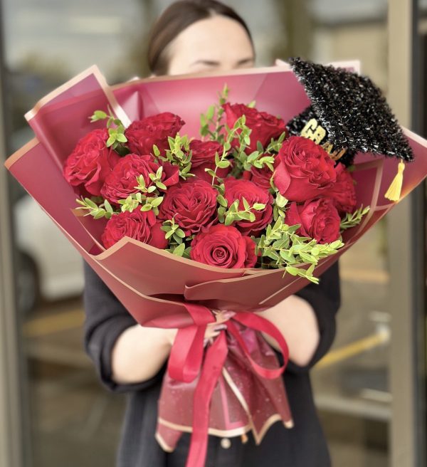 A cheerful Happy Graduate flower bouquet featuring a vibrant mix of fresh arranged in a celebratory fashion.