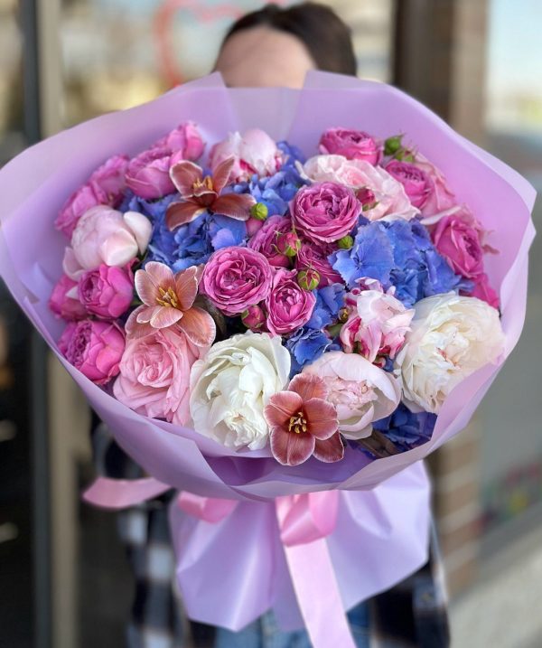 An elegant Moon Symphony flower bouquet featuring a harmonious arrangement of moonlit blooms in soft, serene colors, beautifully presented in a stylish vase.