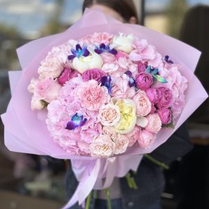 Image of 'Butterfly Touch' bouquet showcasing a charming blend of hydrangeas, dendrobium orchids, roses, spray roses, carnations, and peonies, evoking the graceful essence of a butterfly's touch.