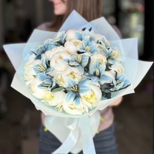 Image of 'Ocean of Love' bouquet showcasing beautiful blue tulips and elegant peonies, perfect for expressing heartfelt emotions on any occasion.