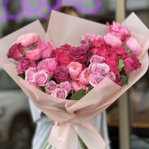 Elegant bouquet 'Floral Fantasies' showcasing a variety of exquisite flowers, perfect for weddings and special occasions.