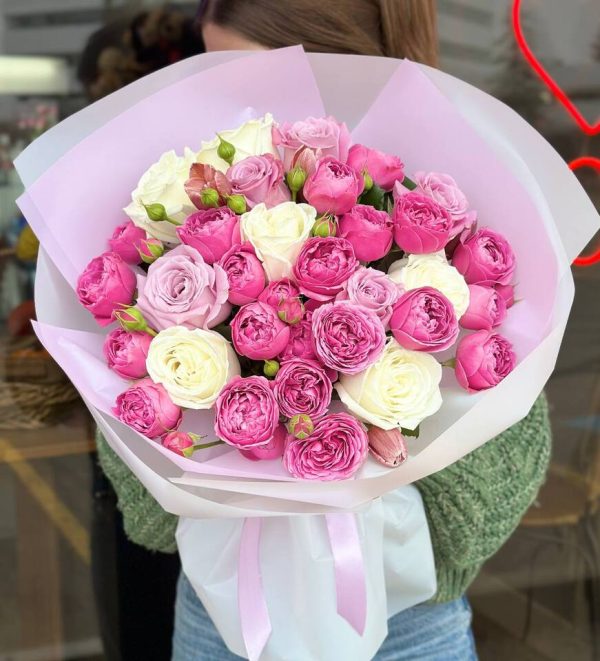 A beautiful bouquet featuring white roses, vibrant purple spray roses, and delicate tulips, creating an elegant and charming arrangement perfect for any occasion.